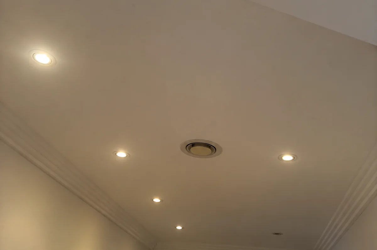 Halogen downlights before LED upgrade, Sydney Before: Sydney bedroom ceiling with six old 50W halogen downlights giving yellow uneven light